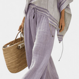 Striped bamboo top with off-the-shoulder design and wide-leg pants for an elegant and fresh style
