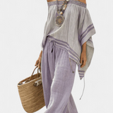 Striped bamboo top with off-the-shoulder design and wide-leg pants for an elegant and fresh style
