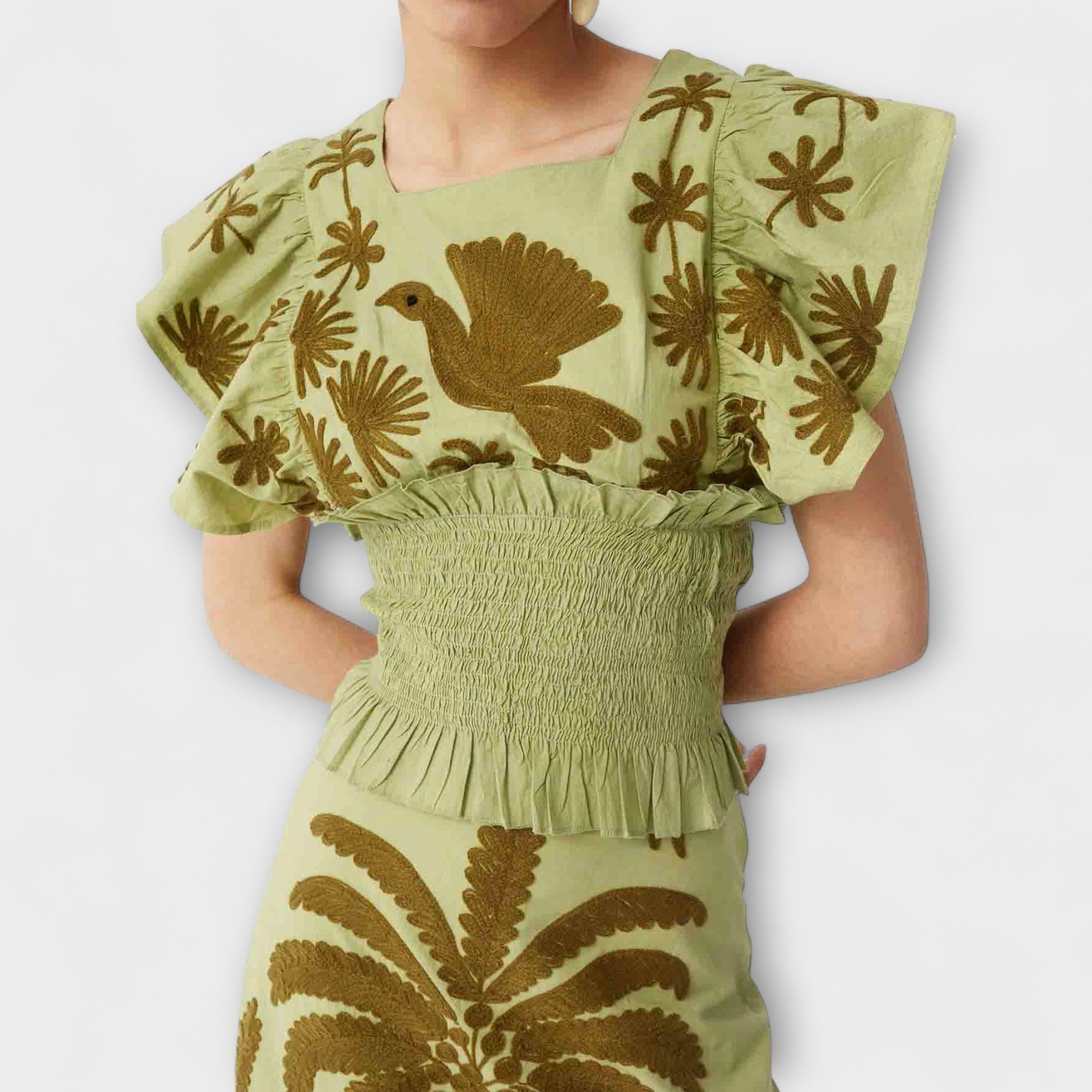 Stylish sleeveless top with palm trees and tropical birds