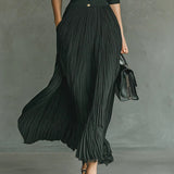 Elvira | Long pleated dress with lapels and a high waist